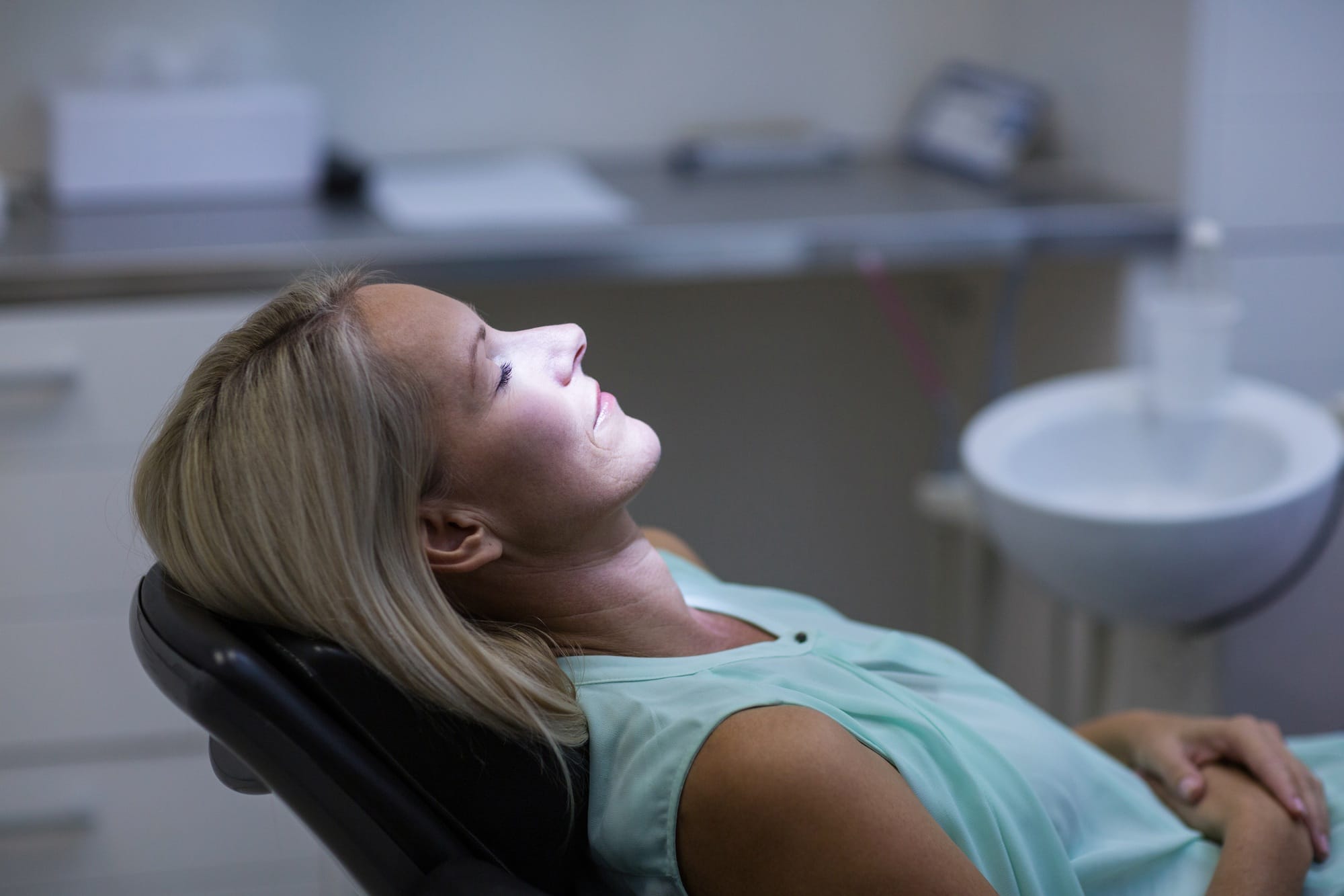 Woman relaxing on dentist chair